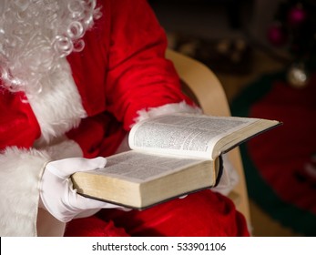 Santa Reading Book In Home