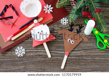Santa and Reindeer stick puppets. Handmade. Project of children's creativity, handicrafts, crafts for kids.