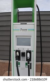 Santa Rosa, N.M., USA - February 5, 2022: A traditional gas station supplemented with electric charging infrastructure provides diverse power options just off the highway. 2I9A9521