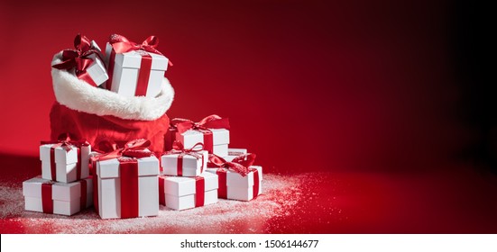 Santa Sack Full With Presents On Red Background