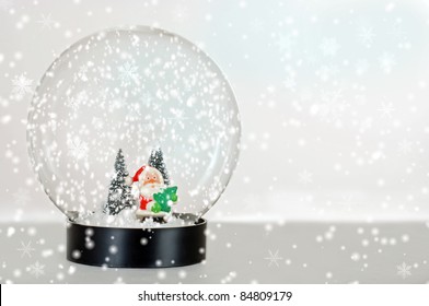 Santa snow globe with falling snow - Powered by Shutterstock