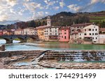 Santa Sofia, Forli Cesena, Emilia Romagna, Italy: landscape of the ancient town with the picturesque houses on the river shore and the Apennine mountains on background 

