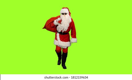 Santa in sunglasses carrying gifts in sack on green screen background, Chroma key - Powered by Shutterstock