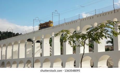 Santa Teresa Tram Crossing Lapa Arches In Rio De Janeiro