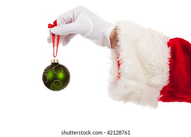 Santa's Hand Holding A Green Christmas Ornament On A White Background