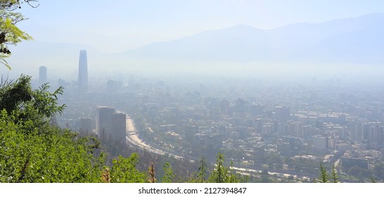 Santiago - Chile - February 10, 2022: panoramic view of the city during a fog and pollution episode in morning summer light.