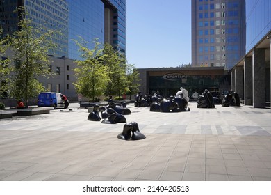 Santiago - Chile - February 10, 2022: street art in front of Costanera center in business district: black shiny sculptures representing persons kissing.