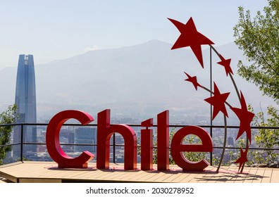 Santiago, Chile - Jan 7, 2021: Chile red sign in San Cristobal mountain view point with Costanera Center building on background. Sunny day in urban area with iconic landmark