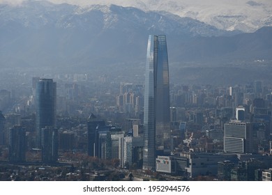 Santiago, Chile - June 15, 2019: The Gran Torre Santiago skyscraper (Costanera Center Torre 2) and Costanera Center in the financial district nicknamed "Sanhattan", against the backdrop of the Andes.