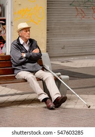 SANTIAGO, CHILE - NOV 1, 2014:  Unidentified Chilean Old Man Sits On A Bench In Santiago. Chilean People Are Mainly Of Mixed Spanish And Indigenous Descent