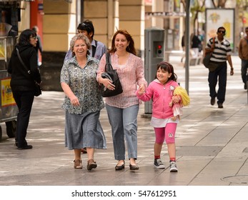 SANTIAGO, CHILE - NOV 1, 2014:  Unidentified Chilean Family Walks In Santiago. Chilean People Are Mainly Of Mixed Spanish And Indigenous Descent
