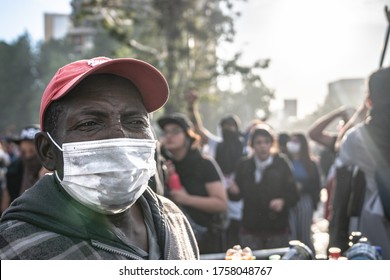 Santiago De Chile 05/11/2020 Haitian Person Meets With Mask Protected From Covid 19 In Protest At Plaza Baquedano