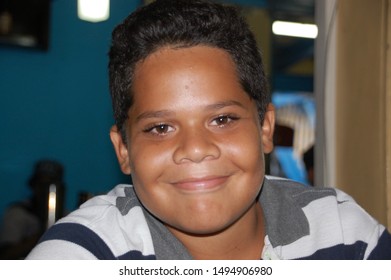 Santiago De Cuba / Cuba - May 5, 2016: Cuban Boy Smiles For The Camera At A Music And Dance Performance For Travelers In Santiago De Cuba