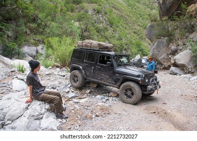 Santiago Nuevo Leon, Mexico. July 16, 2022.   All Terrain Jeep Vehicle Passing A Difficult Path In A Rocky Road.