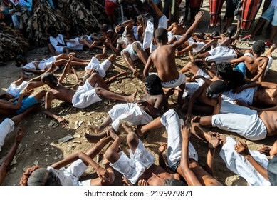 Santo Amaro, Bahia, Brazil - July 24, 2022: Members Of The Cultural Manifestation Nego Fugido Lying On The Ground For The End Of Slavery In Acupe, Santo Amaro, Bahia.