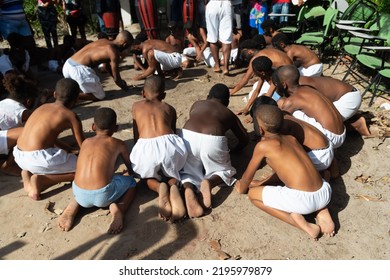 Santo Amaro, Bahia, Brazil - July 24, 2022: Members Of The Cultural Event Nego Fugido Sing And Sit On The Ground For The End Of Slavery In Acupe, Santo Amaro, Bahia.