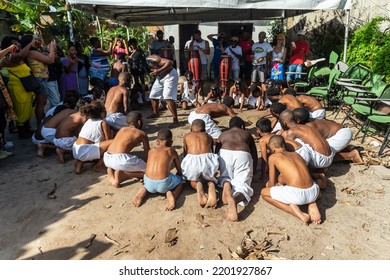 Santo Amaro, Bahia, Brazil - July 24, 2022: Members Of The Cultural Event Nego Fugido Sing And Sit On The Ground For The End Of Slavery In Acupe, Santo Amaro, Bahia.