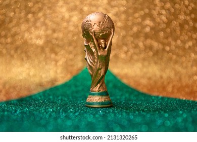 Vitória, Espírito Santo, Brazil - March 02, 2022 -  Copy of world cup trophy on background green, yellow and golden.