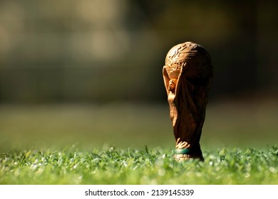 Vitória, Espírito Santo, Brazil - March 25, 2022 -  Copy Of Soccer World Cup Trophy On Soccer Field Lawn