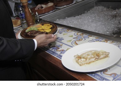 Santo Domingo, Dominica Republic - 17 March 2018 - Waiter With Dishes Served By Chef For Customers Food, Fine And Delicious Food In Restaurant In Dominican Republic