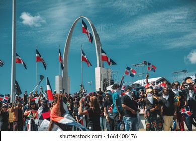 Santo Domingo, Dominican Republic, 02-27-2020: Protesters Gather At La Plaza De La Bandera To Celebrate Dominican Independence Day And Demand Demand Answers From The Central Electoral Board.