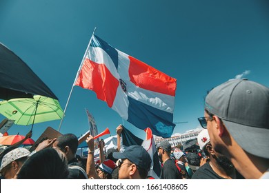 Santo Domingo, Dominican Republic, 02-27-2020: Protesters Gather At La Plaza De La Bandera To Celebrate Dominican Independence Day And Demand Demand Answers From The Central Electoral Board.