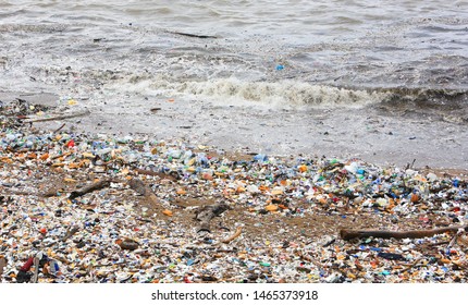 Santo Domingo, Dominican Republic - Aug 24, 2014: Garbage, plastic bags and bottles covering a city beach of Santo Domingo, the capital of the Dominican Republic.