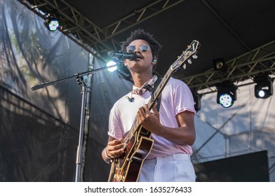SANTO DOMINGO/DOMINICAN REPUBLIC- FEBRUARY 2, 2020: Main singer of Dominican music band Pororó  plays guitar onstage during Santo Domingo Pop festival at National Botanical Garden.