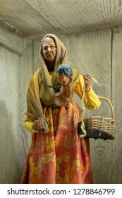 Santon de Provence (traditional figurine from the south of France for Christmas crib), woman and child, work of a midwife, cut-out object - Shutterstock ID 1278846799
