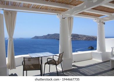 Santorini, Greece - July 20, 2016: Cozy and comfy private terrace with panoramic view, located in Katikies Hotel in Oia. The place is a main destination for vacations, holidays, honeymoon and renewals