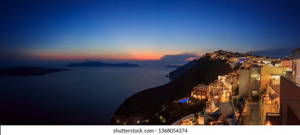 Santorini, Greece. Late evening, sunset view of Fira town, Oia village. A beautiful volcanic island resulted from a super volcano eruption Aegean sea. Extra large size panorama with lot of details. 