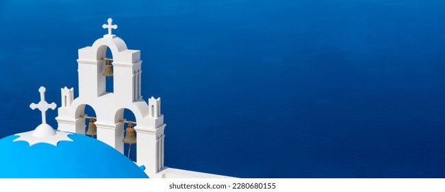 Santorini, Greece panoramic copy space banner with white Greek orthodox church and blue sea in Oia