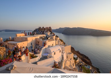 Santorini, Greece - September 17, 2020: Famous tourist attraction, Oia village in Santorini during sunset. - Shutterstock ID 1890247558