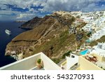 SANTORINI (THERA), CYCLADES, GREECE - Relaxing panoramic sea view from Fira in the direction of Imerovigli, with Ormos Firon bay, Skaros rock, Oia and a cruise ship in the distance.