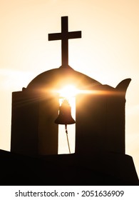 Santorini, Thira Greece - September 09 2021 - Sunset and a church silhouette in Santorini