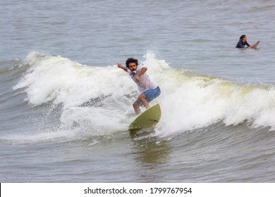 Santos/SP/BR - Fevereiro 11,2020: Man Surfing And Catching The Wave, Holding A Gopro In His Mouth.