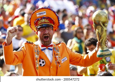 SAO PAOLO, BRAZIL - JUNE 23, 2014: A fan celebrates during the World Cup Group B game between the Netherlands and Chile at the Arena Corinthians. NO USE IN BRAZIL.