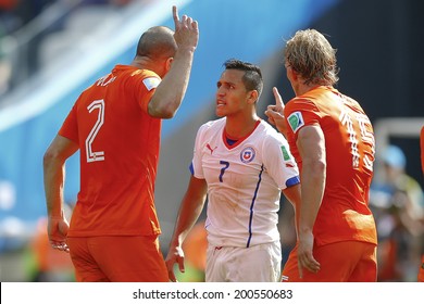 SAO PAOLO, BRAZIL - JUNE 23, 2014: Kuyt, Vlaar of the Netherlands and Sanchez of Chile during the World Cup Group B game between the Netherlands and Chile at the Arena Corinthians. NO USE IN BRAZIL.
