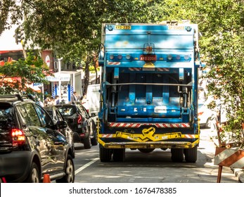 Sao Paulo, Brazil, April 01, 2019. Residential Garbage Collection Truck Travels Down A Street In The Central Region Of Sao Paulo