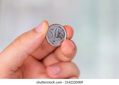 
Sao Paulo, Brazil. APRIL 3, 2022: Brazilian 50 cents coin in the palm of a person. Hand holding a 50 real cents coin. Real is the currency system of the Brazilian Government.
