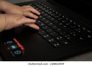 Sao Paulo, São Paulo, Brazil - August 07 2022: Child Typing On A Laptop Keyboard