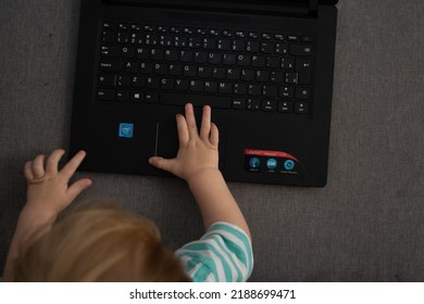 Sao Paulo, São Paulo, Brazil - August 07 2022: Child Typing On A Laptop Keyboard