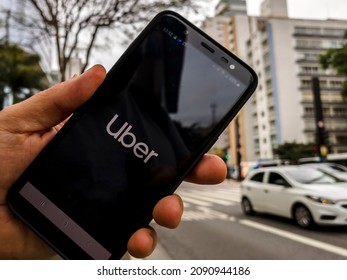 Sao Paulo, Brazil December 07 2021. Uber app displayed on smartphone held in hand in Paulista Avenue, central region of Sao Paulo city