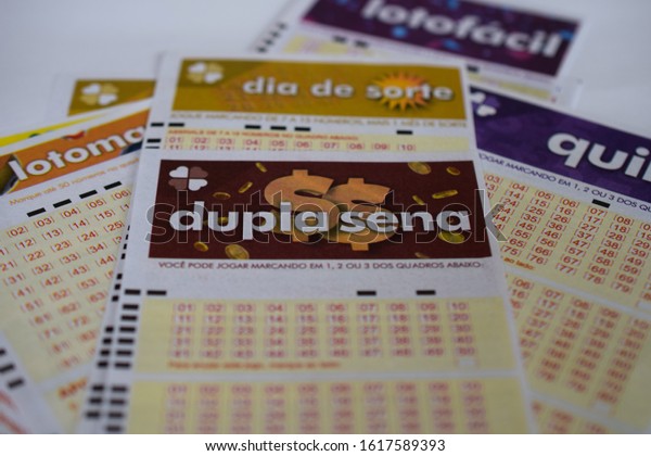 Sao\
Paulo, Brazil - January 16, 2020 - Several lottery tickets,\
highlighting Double Sena. Caixa Econômica Federal lottery tickets,\
the only legalized gambling game in the\
country.