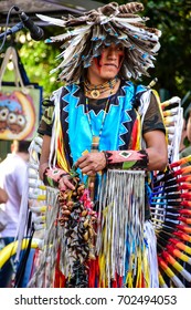 SAO PAULO, SAO PAULO - BRAZIL - JUL 30, 2017: Indigenous Street Singers With Indian And Cacique's Clothing