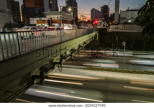Sao Paulo, Brazil, July 21,\
2021. Time lapse of Traffic on 23 de Maio Avenue, at night in Sao\
Paulo