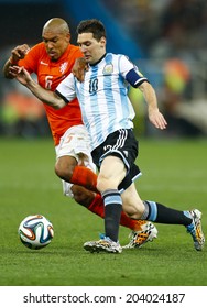 SAO PAULO, BRAZIL - July 9, 2014: Lionel Messi And Nigel De Jong During The 2014 World Cup Semi-finals Game Between The Netherlands And Argentina At Arena Corinthians. NO USE IN BRAZIL.