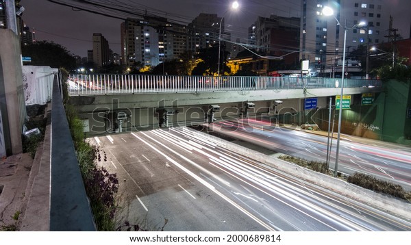 Sao Paulo, Brazil, May 09,\
2021. Time lapse of Traffic on 23 de Maio Avenue, at night in Sao\
Paulo
