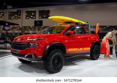 SAO PAULO, BRAZIL - NOVEMBER 15, 2018: A Red Fiat Toro Freedom 4x4 Diesel Pickup Truck Styled As Beach Life Guard Vehicle Inside Fiat Automobiles Pavilion At 2018 Sao Paulo International Motor Show.