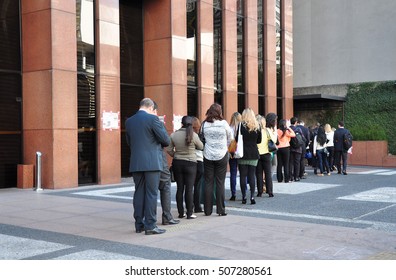 Sao Paulo, Brazil - October 5: People Standing In A Line To Enter Office Building On Avenida Paulista In The Morning On October 5, 2014 In Sao Paulo, Brazil.